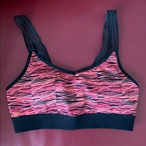 Pink, orange, and black champion sports bra